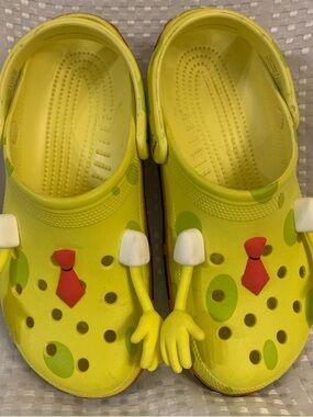 SpongeBob SquarePants CROCS, yellow with SpongeBob designs, men’s 9, women’s 11.